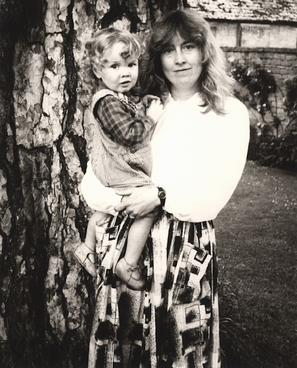 Catherine Guinness holding a Child by Andy Warhol
