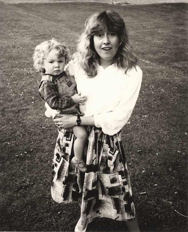 Catherine Guinness holding a Child by Andy Warhol