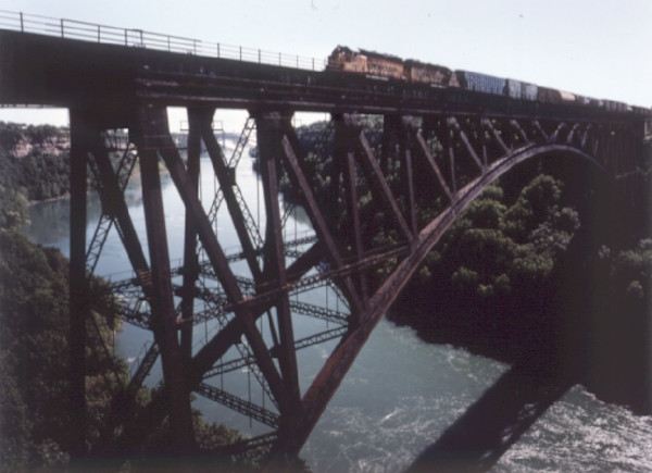Railroad Bridge with Freight Train by John Pfahl