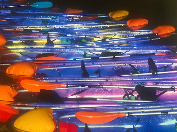Glow Paddle Canoes Waiting for Riders by KC Kuhnert