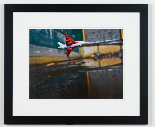 Inches Above Earth Series "Approximate Altitude 9.7 Inches " (Red & White Jet over Water) by Michael Reese