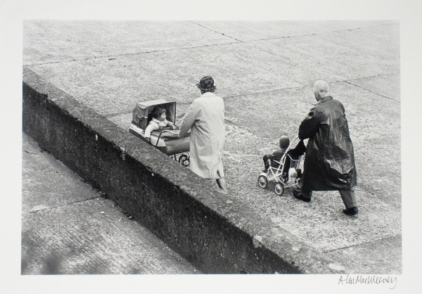 Older Couple Walking with Children, Dublin by Alen MacWeeney