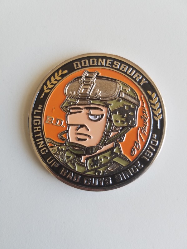 "Lighting up bad guys since 1970" -- Challenge medal by Garry Trudeau