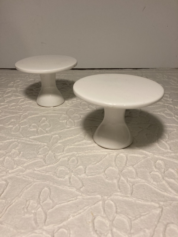 pair of small white pottery stands