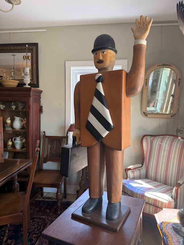 folk sculptural wooden man with brief case