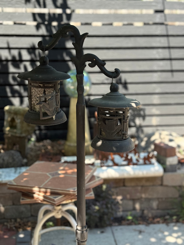 iron garden post with 2 lanterns