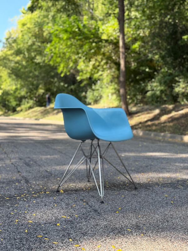 Blue Herman Miller shell arm chair