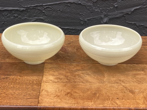 pair of custard glass globes