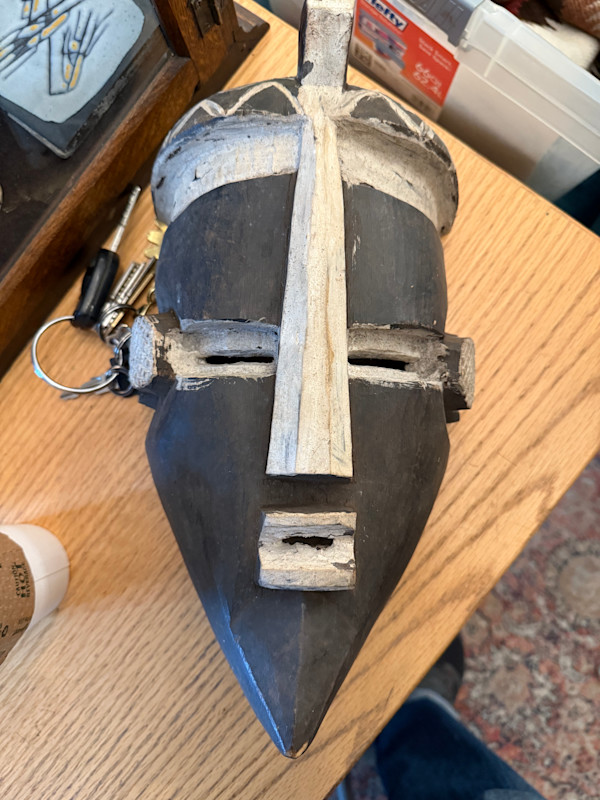 carved wooden African mask, likely a Songye or Luba Kifwebe mask from the Democratic Republic of the Congo.