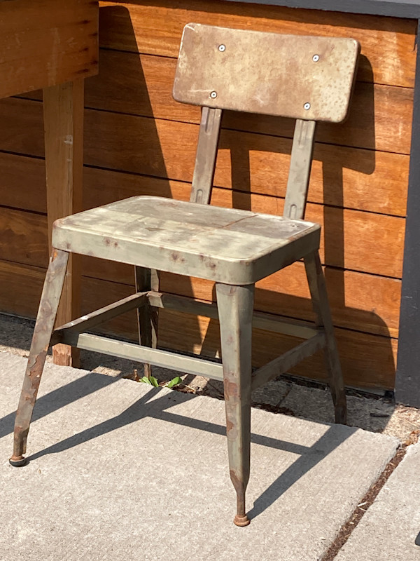 pair of industrial metal chairs