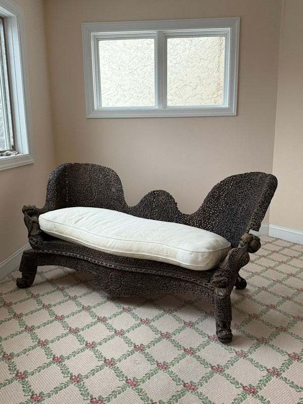 Heavily carved Anglo Indian sofa