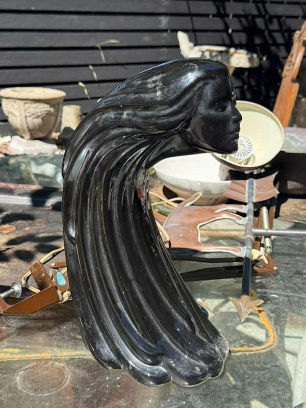 decorative swooping pottery woman head with flowing hair