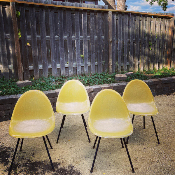 4 matching yellow scoop fiberglass chairs