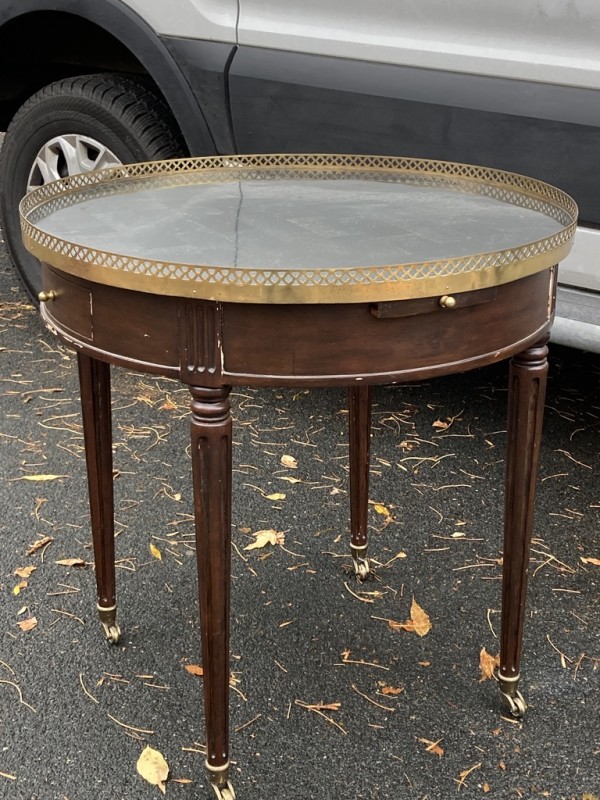 Round mahogany side table with brass gallery