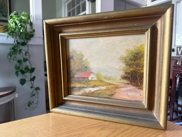 landscape painting on board with red house, Image 2.