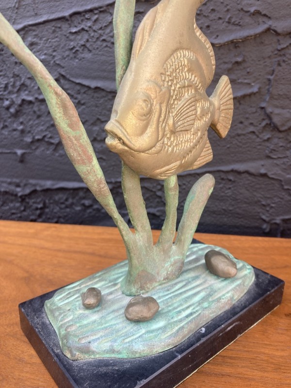 Fish sculpture on marble base