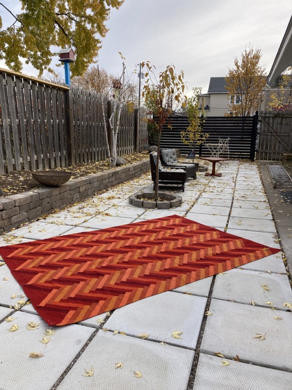 Hand made orange woven wool rug