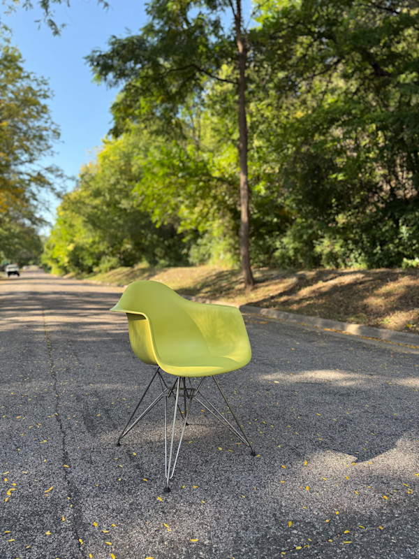 Yellow Herman Miller shell arm chair