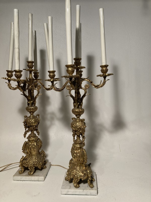 Pair of tall electrified ornate candleabra with marble bases