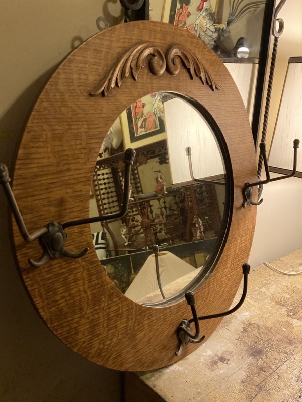 Turn of the century round oak mirror with hooks