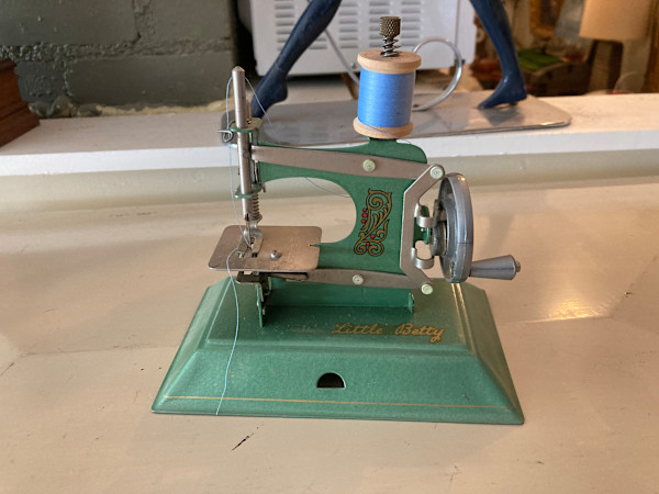 vintage green toy sewing machine
