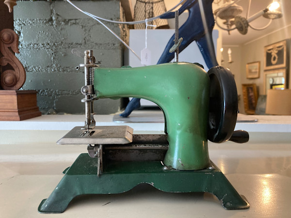 vintage green toy sewing machine