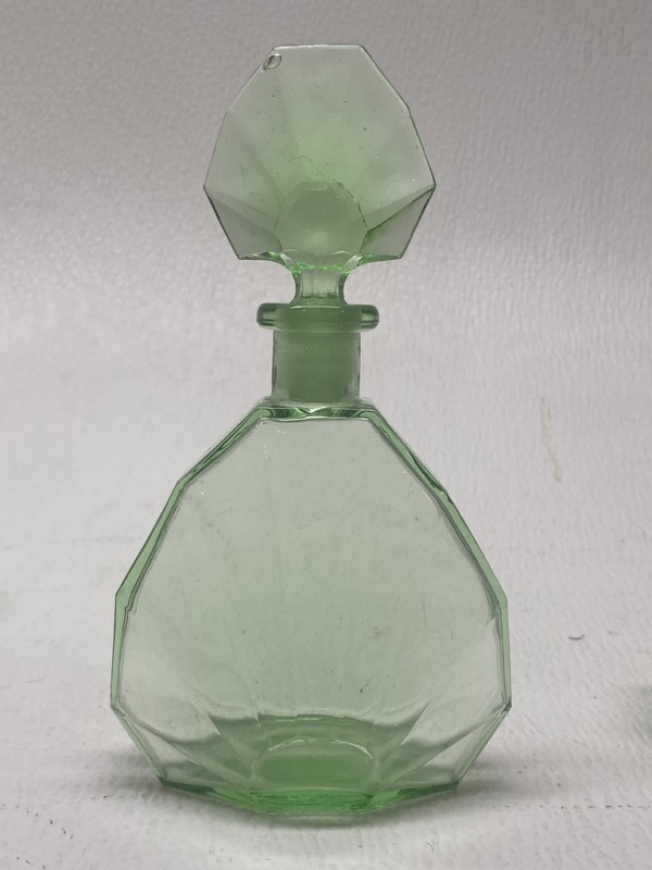 Emerald green perfume bottle