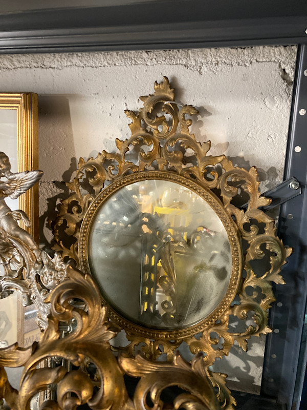 Round carved metal dresser mirror