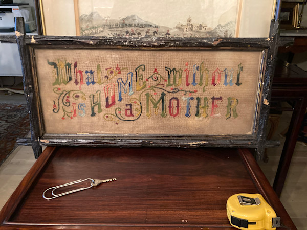 What is a home without a mother framed motto