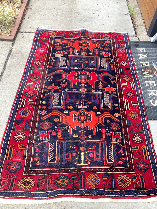 Vintage handmade wool rug with camels