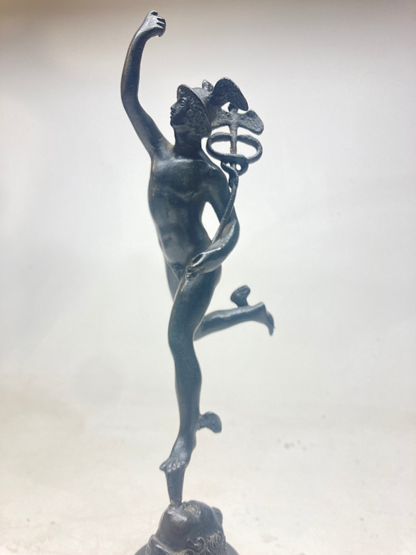 Mercury sculpture on marble base
