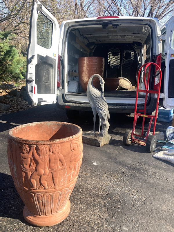 large cement vase with figures