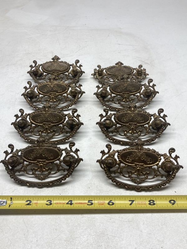 Set of 8 ornate handles