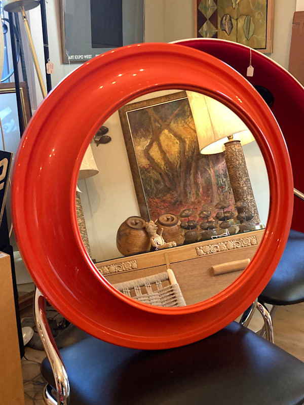 Round 1970's modern orange mirror