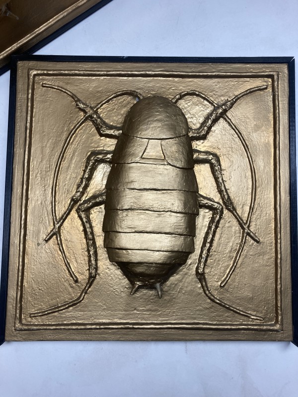 Carved scarab wall relief