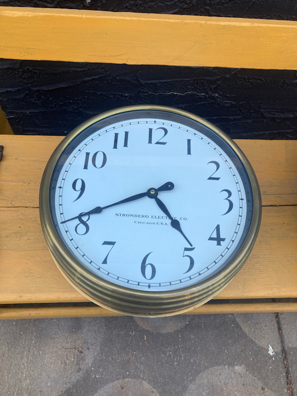 round wall clock in brass