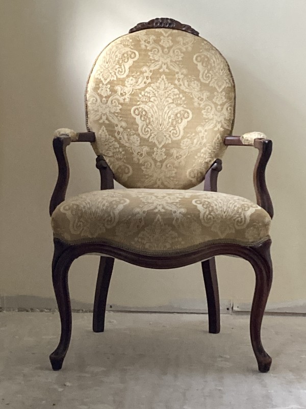 Pair of upholstered ornate medallion back chairs