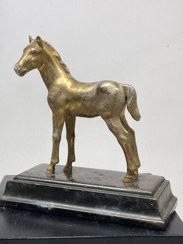 Brass metal colored horse