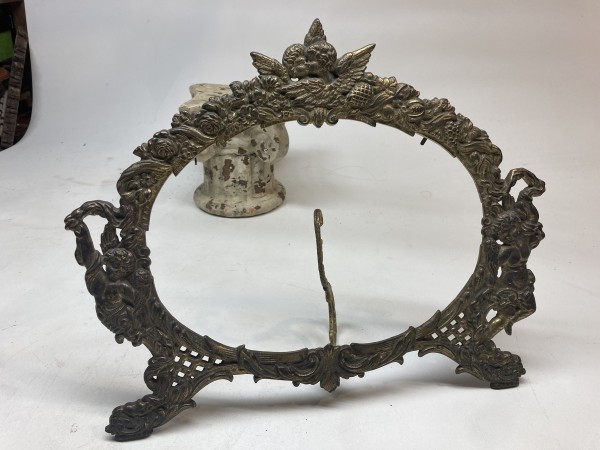 Turn of the century cast iron cherubial oval frame