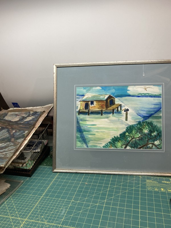 Framed watercolor  of house on stilts and pelicans by Elizabeth Grant