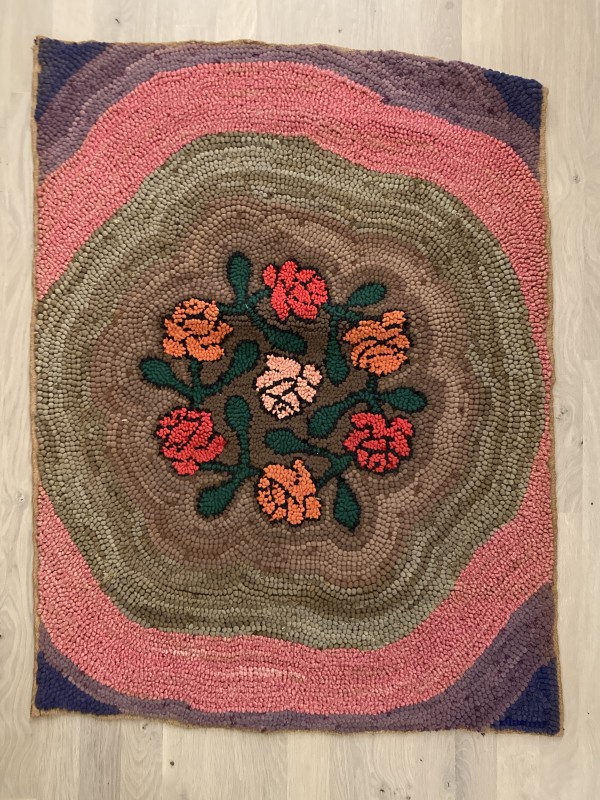 Rose patterned vintage hooked rug