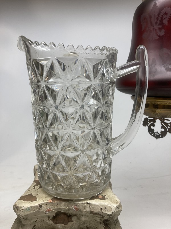clear glass water pitcher with geometric pattern