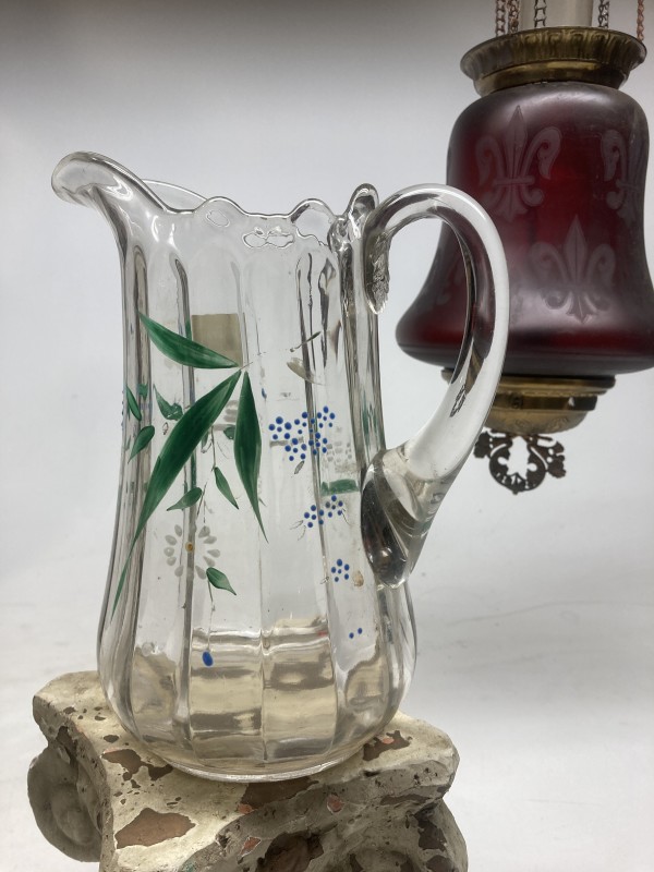 Clear glass water pitcher with hand painted details