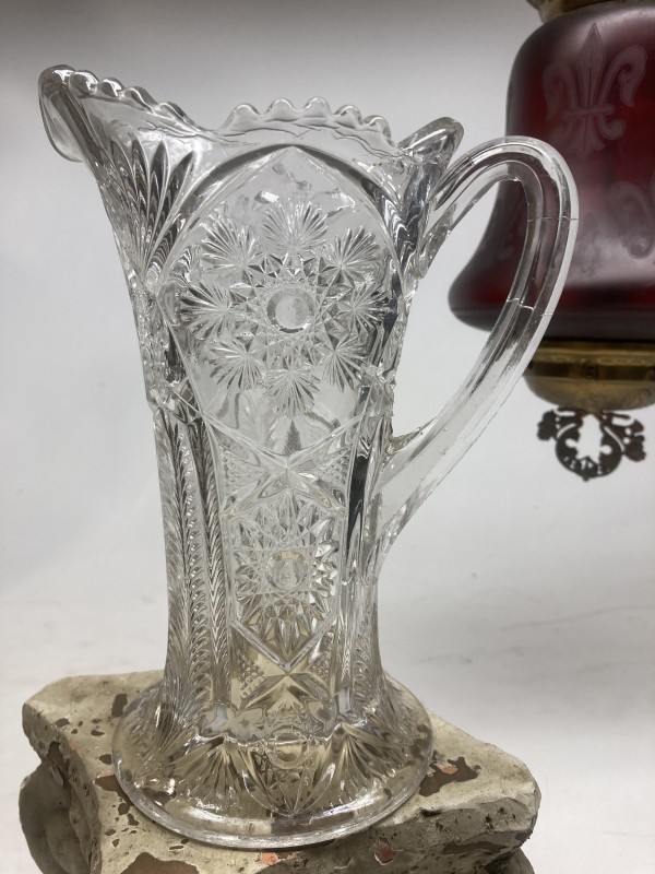Ornate clear glass water pitcher