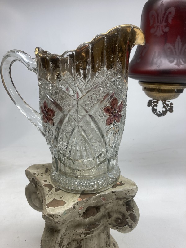 Early ornate water pitcher with ruby and gold