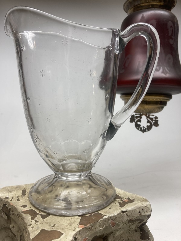 clear glass water pitcher with clear stars