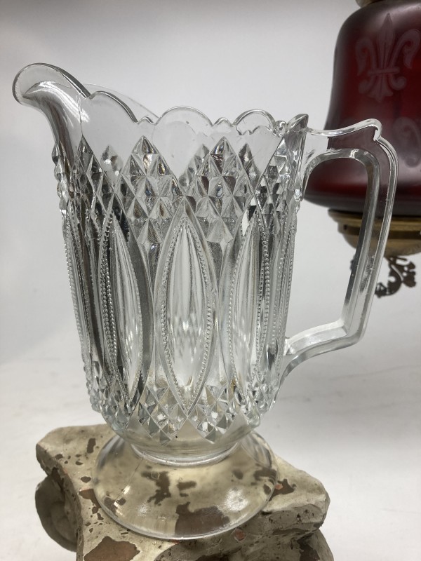 clear glass water pitcher