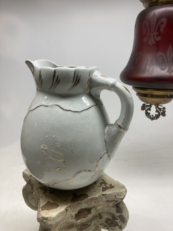 white pottery water pitcher