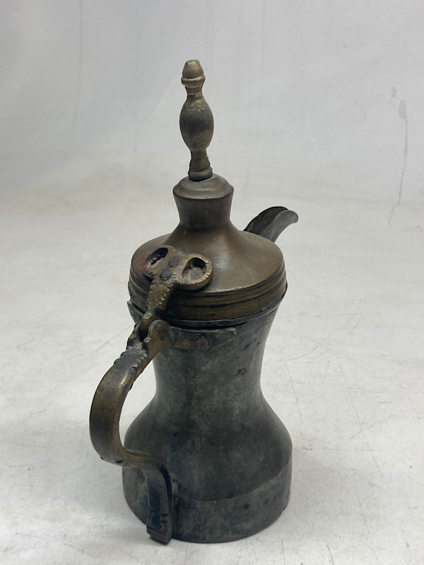 Vintage covered copper pitcher