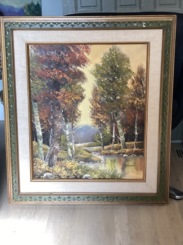 Framed painting of autumn trees